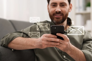 Smiling man with smartphone chatting indoors. Many illustrations of envelope as incoming messages around device