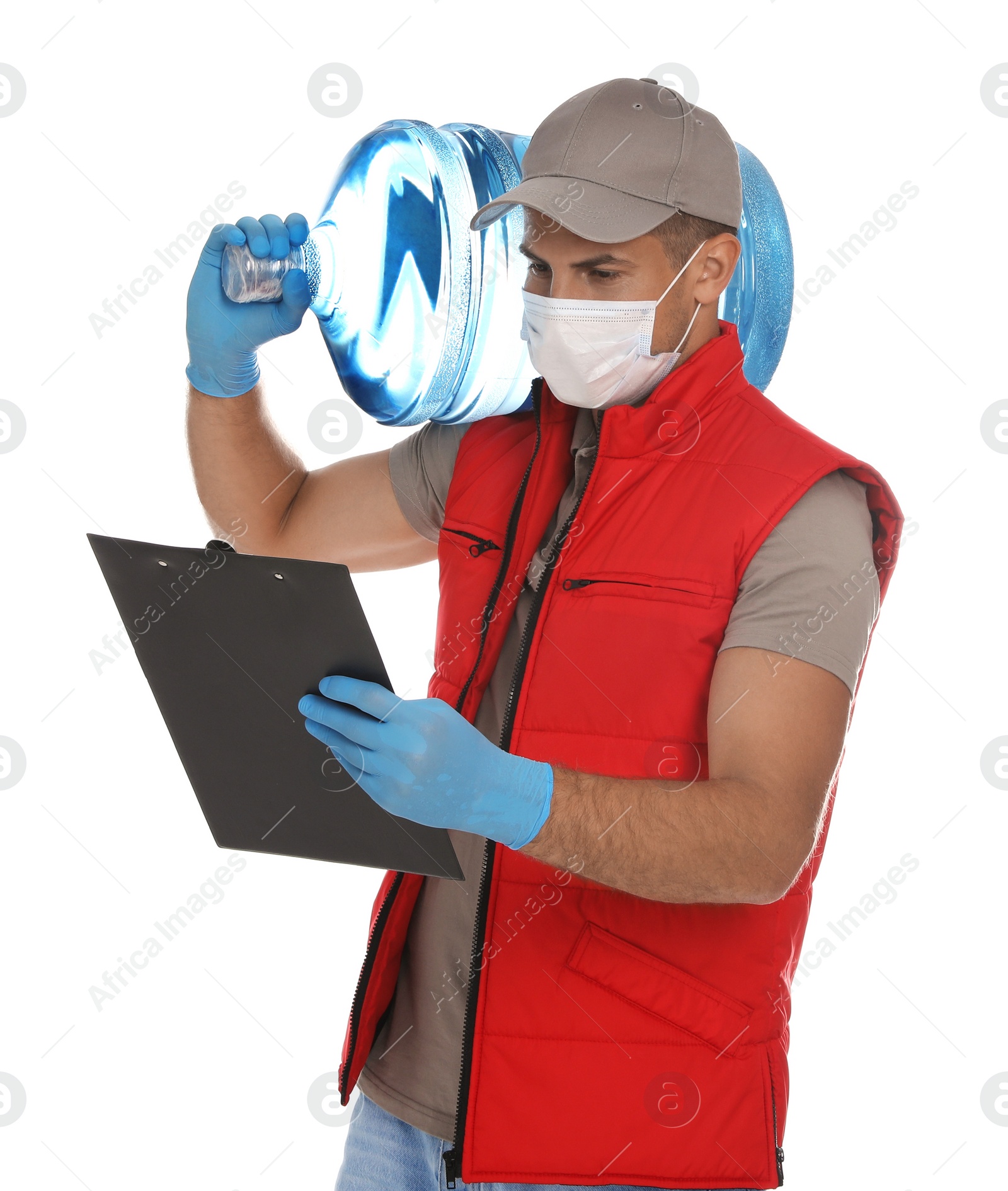 Photo of Courier in medical mask with bottle for water cooler and clipboard on white background. Delivery during coronavirus quarantine