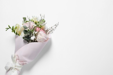 Bouquet of beautiful flowers on white background, top view. Space for text