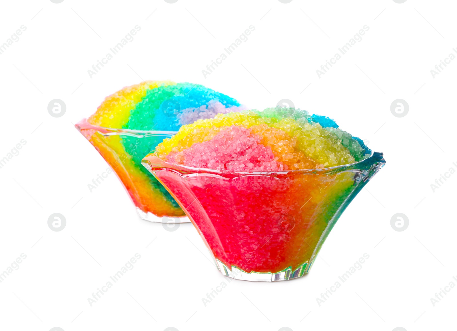 Photo of Rainbow shaving ice in glass dessert bowls isolated on white