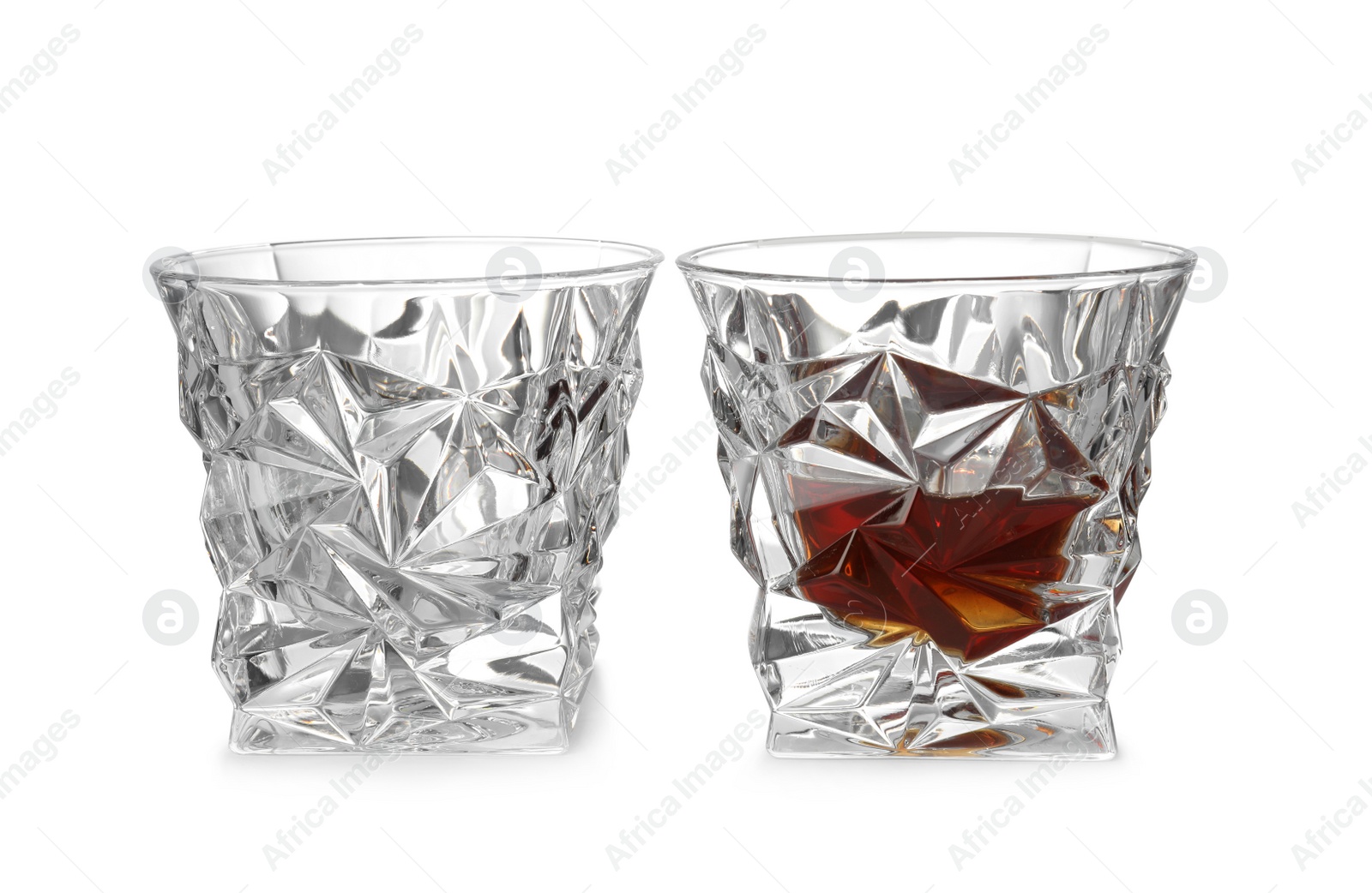 Photo of Empty and full whiskey glasses on white background