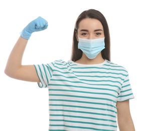 Photo of Woman with protective mask and gloves showing muscles on white background. Strong immunity concept