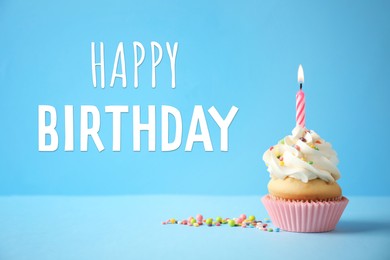 Image of Happy Birthday! Delicious cupcake with candle on light blue background