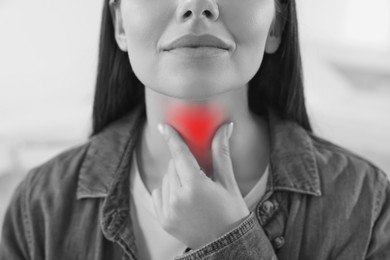 Image of Endocrine system. Woman doing thyroid self examination, closeup. Color accent effect