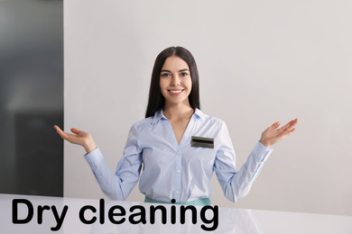 Image of Happy female administrator near counter at modern dry-cleaner's