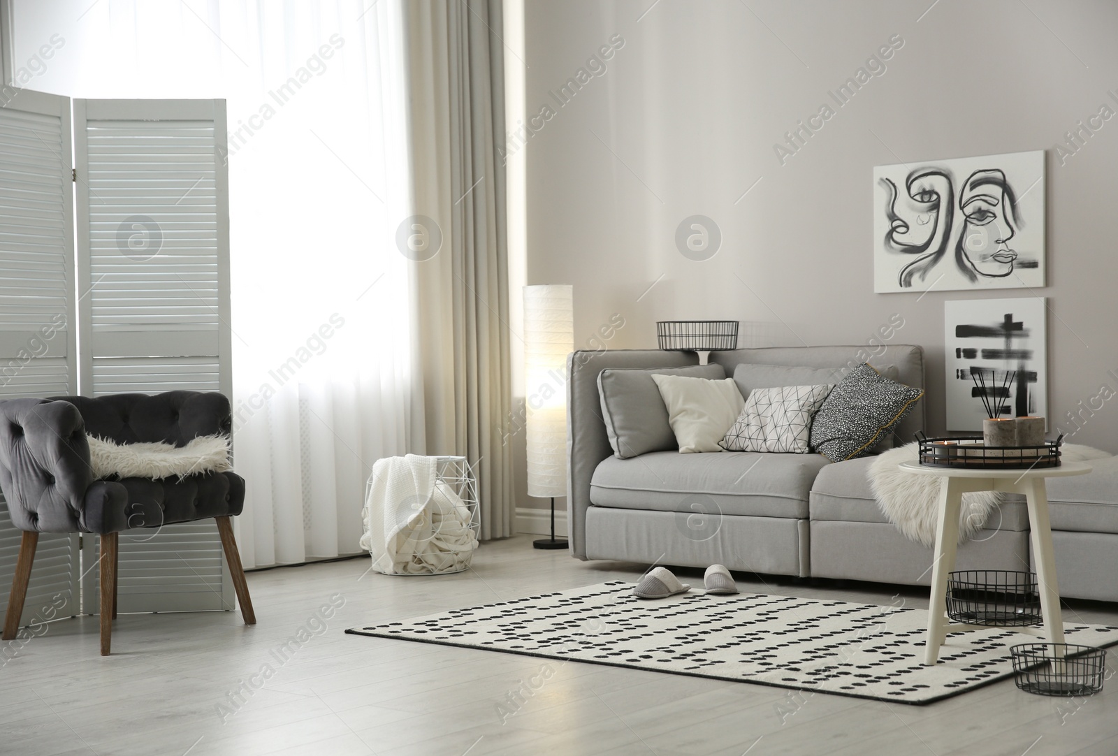 Photo of Cozy living room interior with big grey sofa