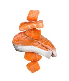 Cut fresh salmon falling on white background