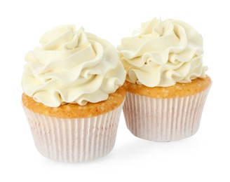 Photo of Tasty vanilla cupcakes with cream isolated on white