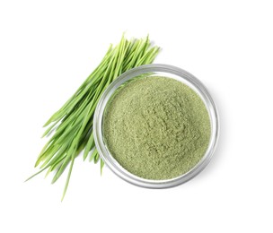 Photo of Wheat grass powder in glass bowl and fresh sprouts isolated on white, top view