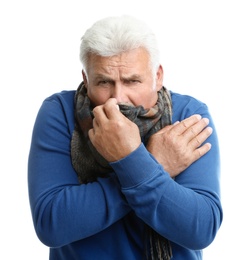 Mature man suffering from cold on white background