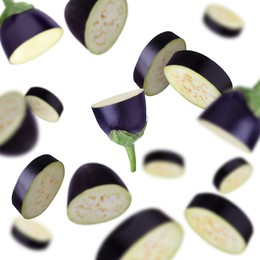 Image of Slices of eggplants falling on white background