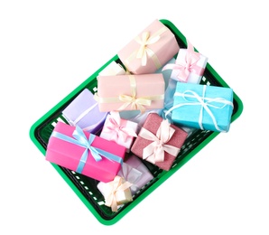 Photo of Shopping basket full of gift boxes on white background, top view