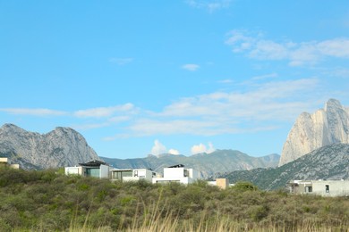 Photo of Town near beautiful mountain landscape under blue sky