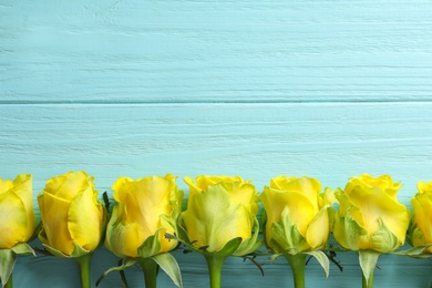 Photo of Flat lay composition with beautiful blooming flowers on wooden background