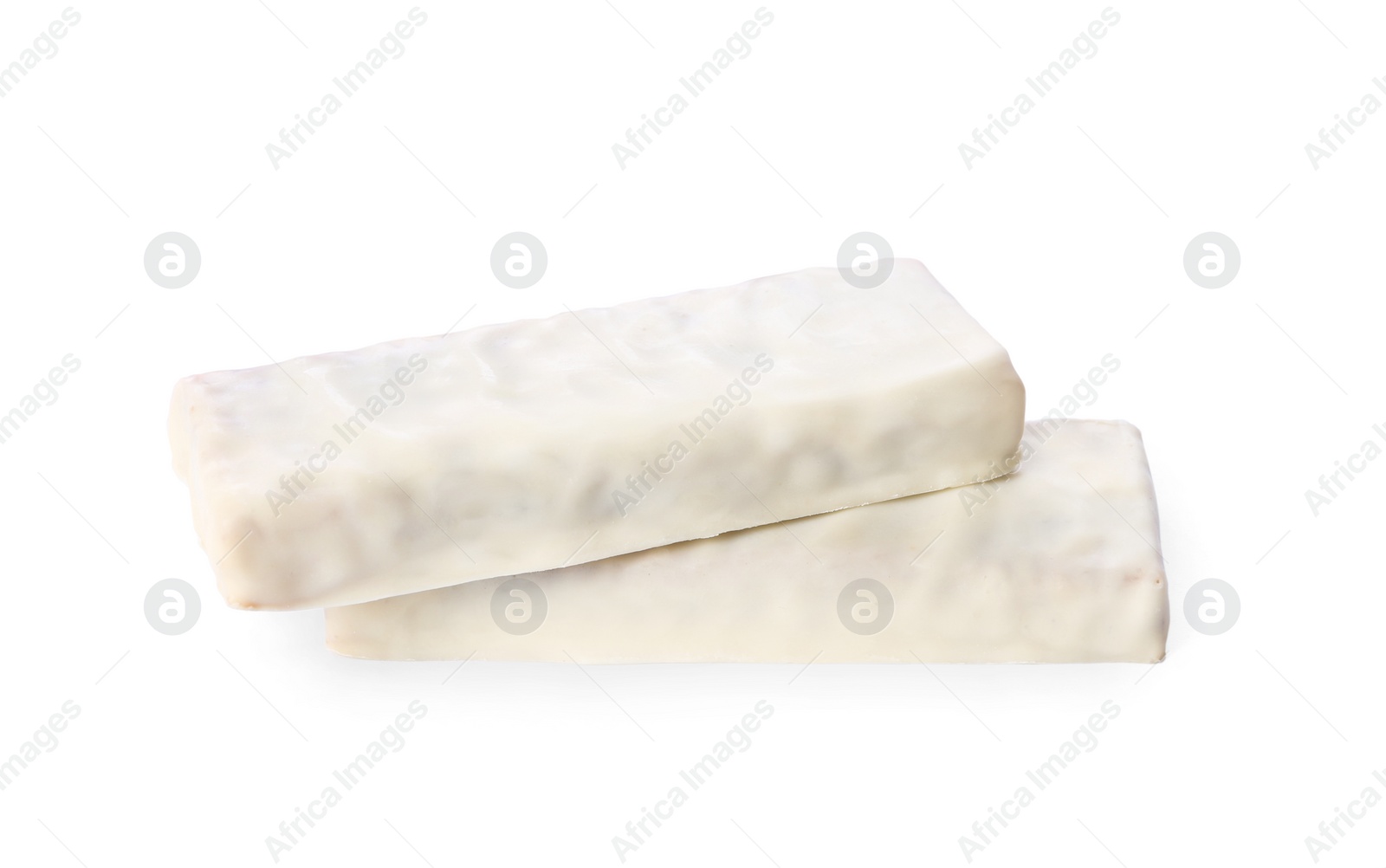 Image of Crunchy granola bars covered with icing on white background