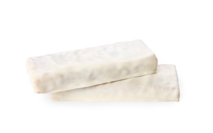 Image of Crunchy granola bars covered with icing on white background