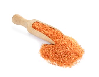 Photo of Wooden scoop with orange salt on white background