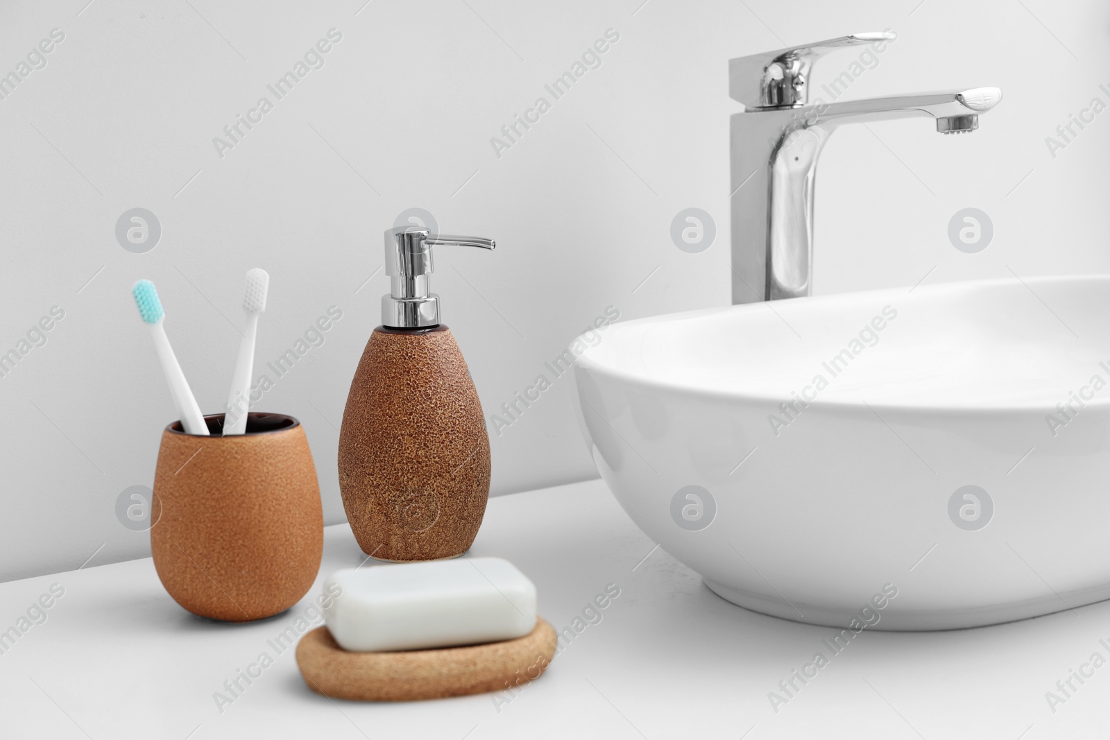 Photo of Set of different bath accessories and products on white table