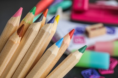 Photo of Colorful pencils against blurred background. School stationery