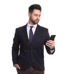 Young businessman with smartphone on white background