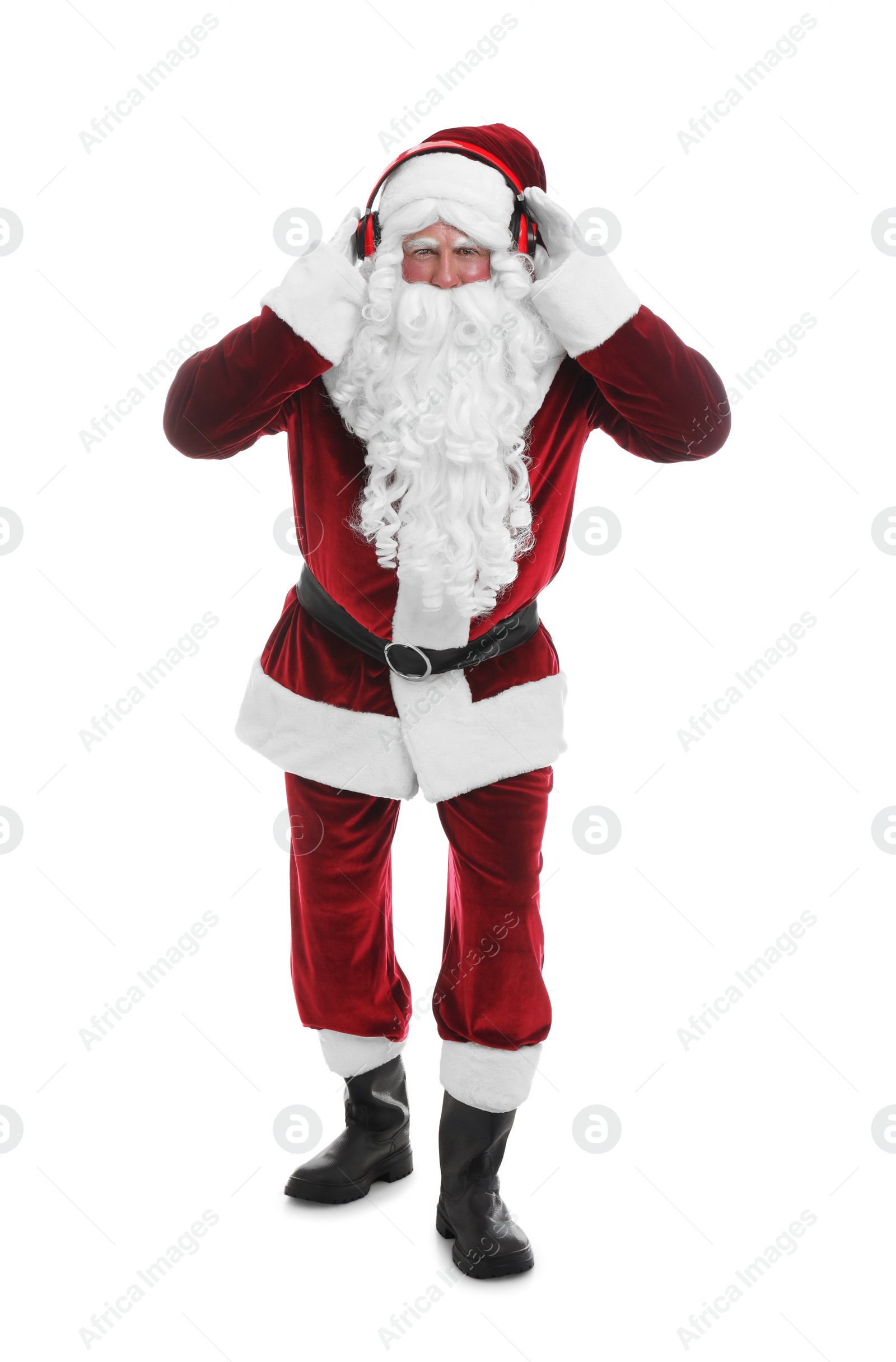 Photo of Santa Claus with headphones listening to Christmas music on white background