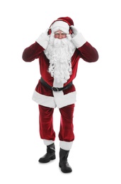 Photo of Santa Claus with headphones listening to Christmas music on white background