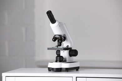 Modern microscope on table indoors. Medical equipment