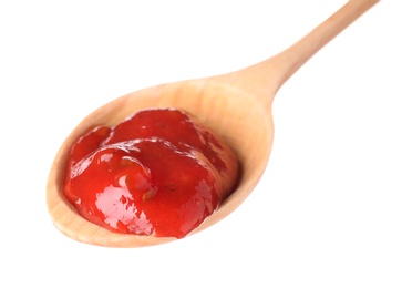 Wooden spoon with red sauce on white background