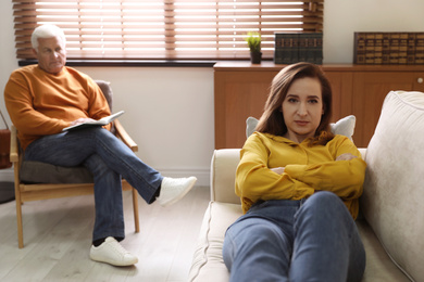 Photo of Professional psychotherapist working with patient in office