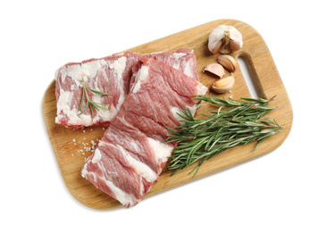 Photo of Raw ribs with rosemary, salt and garlic on white background, top view