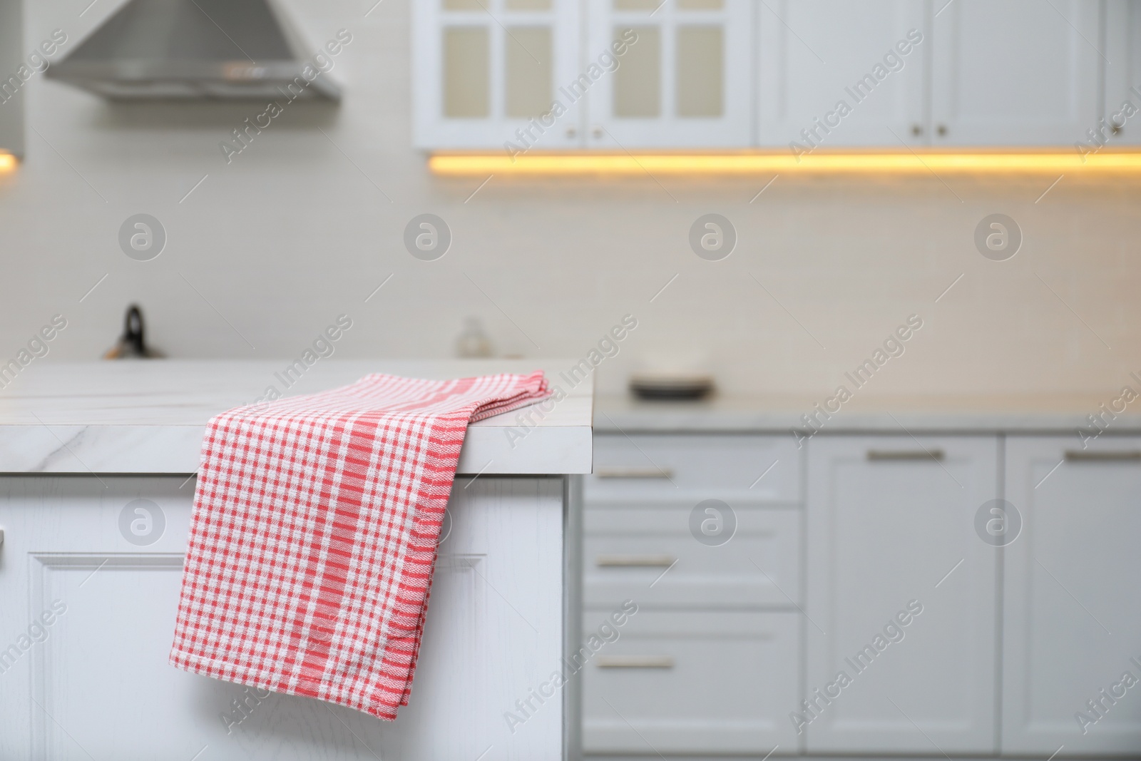 Photo of Clean kitchen towel on marble table at home. Space for text