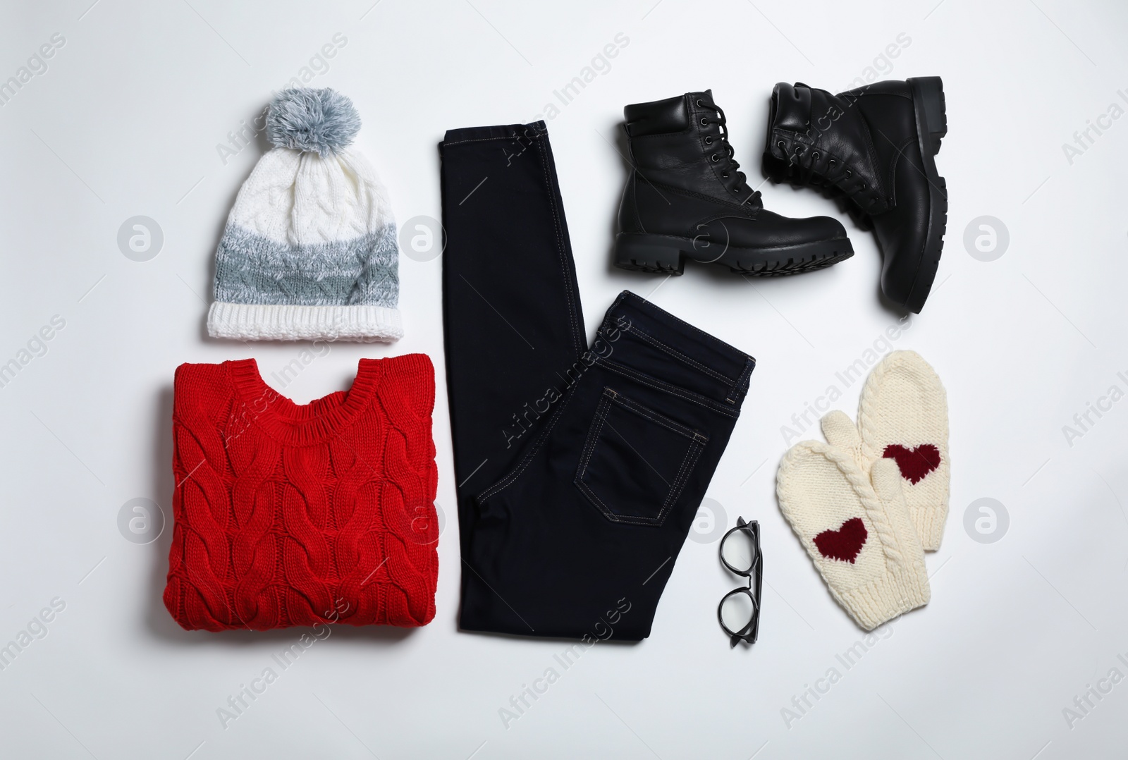 Photo of Flat lay composition with female winter clothes on white background