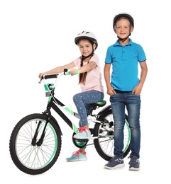 Photo of Portrait of cute little children with bicycle on white background