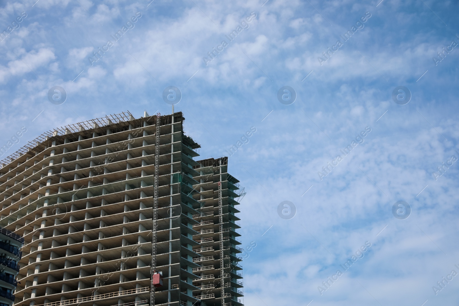 Photo of Construction site with unfinished building on sunny day