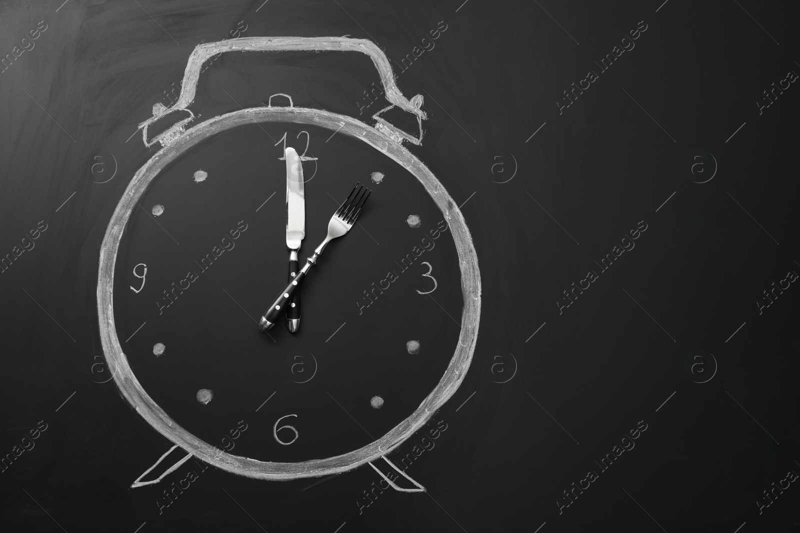 Photo of Drawn alarm clock and cutlery on black surface, top view with space for text. Business lunch concept