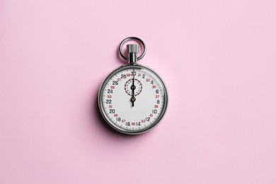 Photo of Vintage timer on pink background, top view