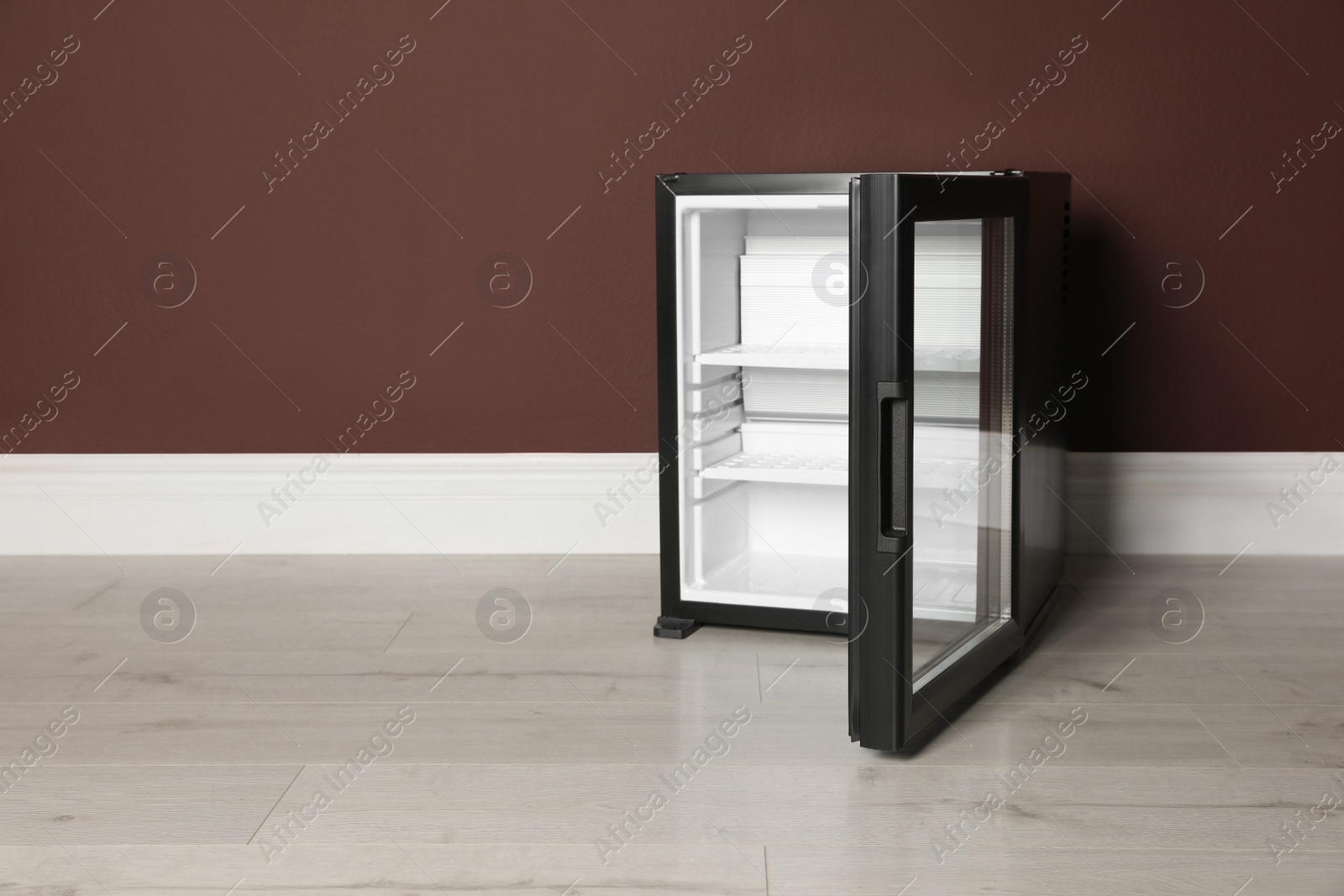 Photo of Empty mini bar near brown wall indoors, space for text