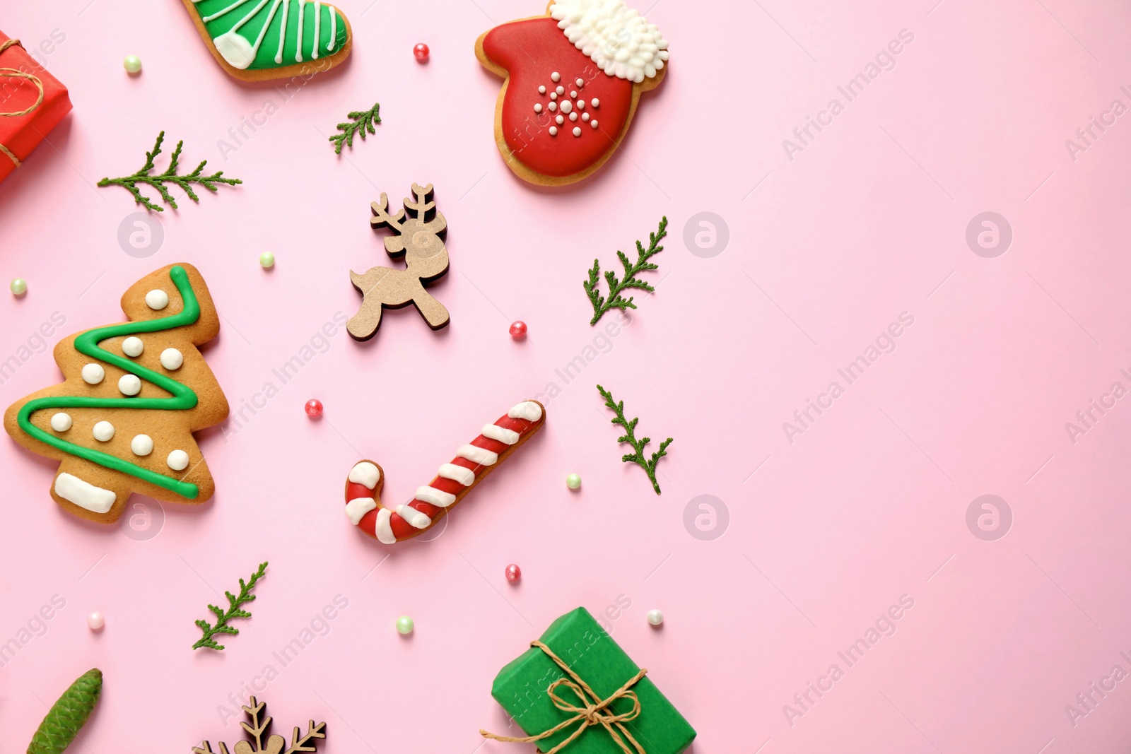 Photo of Flat lay composition with Christmas decorations on pink background