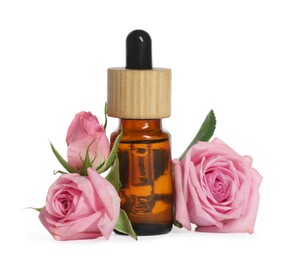 Photo of Bottle of essential rose oil and flowers against white background