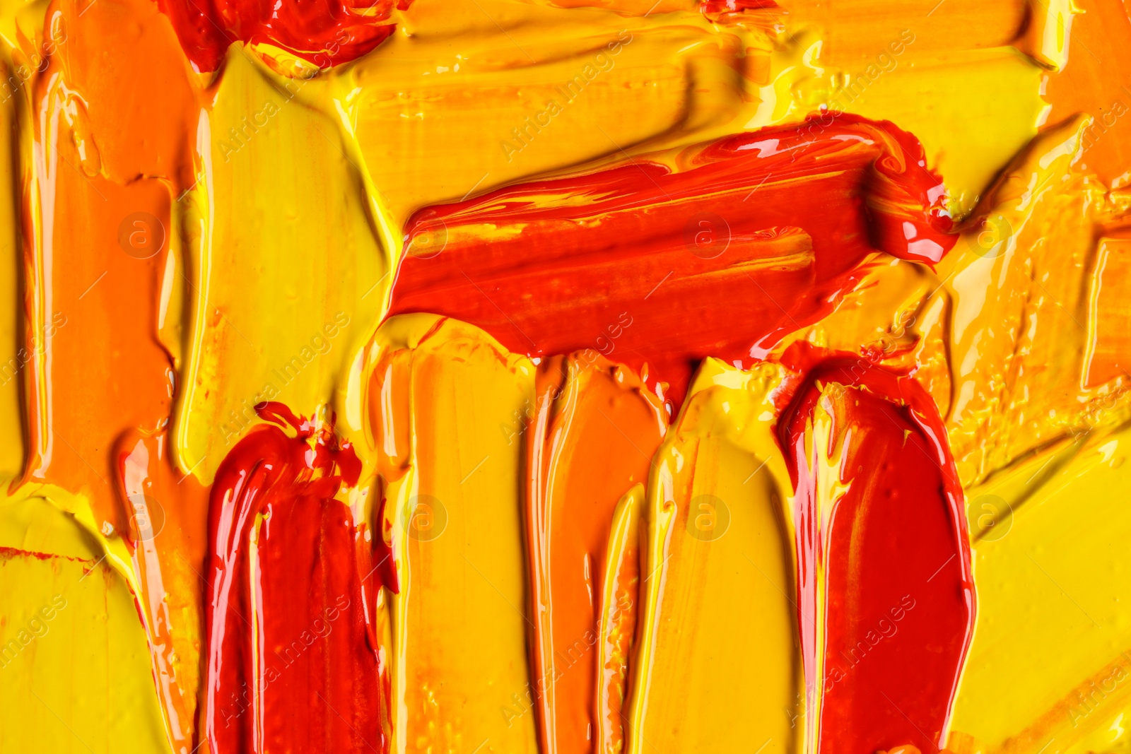 Photo of Beautiful strokes of colorful oil paints as background, closeup