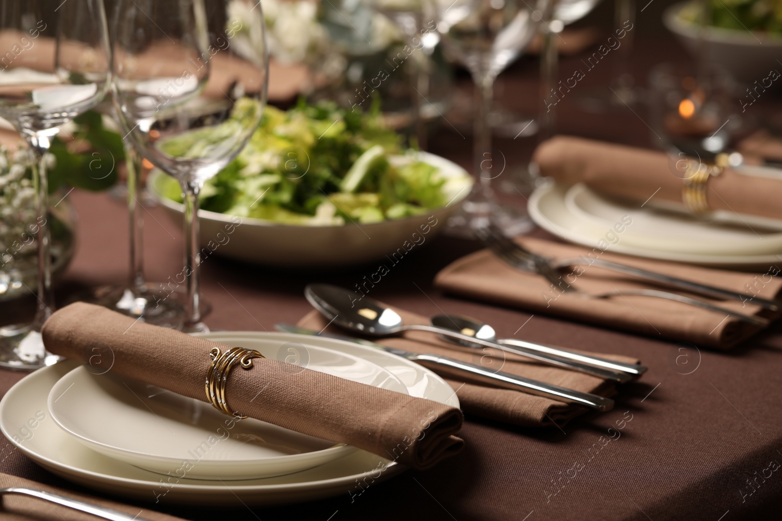 Photo of Stylish elegant table setting for festive dinner in restaurant