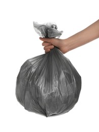 Woman holding trash bag filled with garbage on white background, closeup