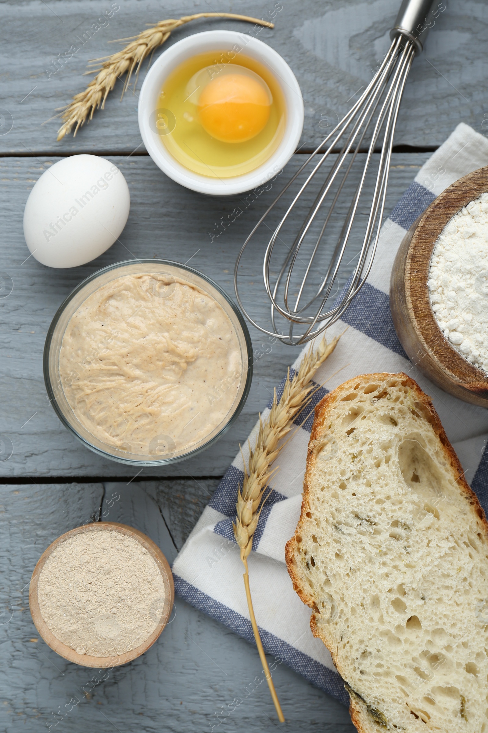 Photo of Flat lay composition with sourdough on grey wooden table