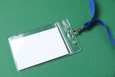 Photo of Blank badge with string on green background