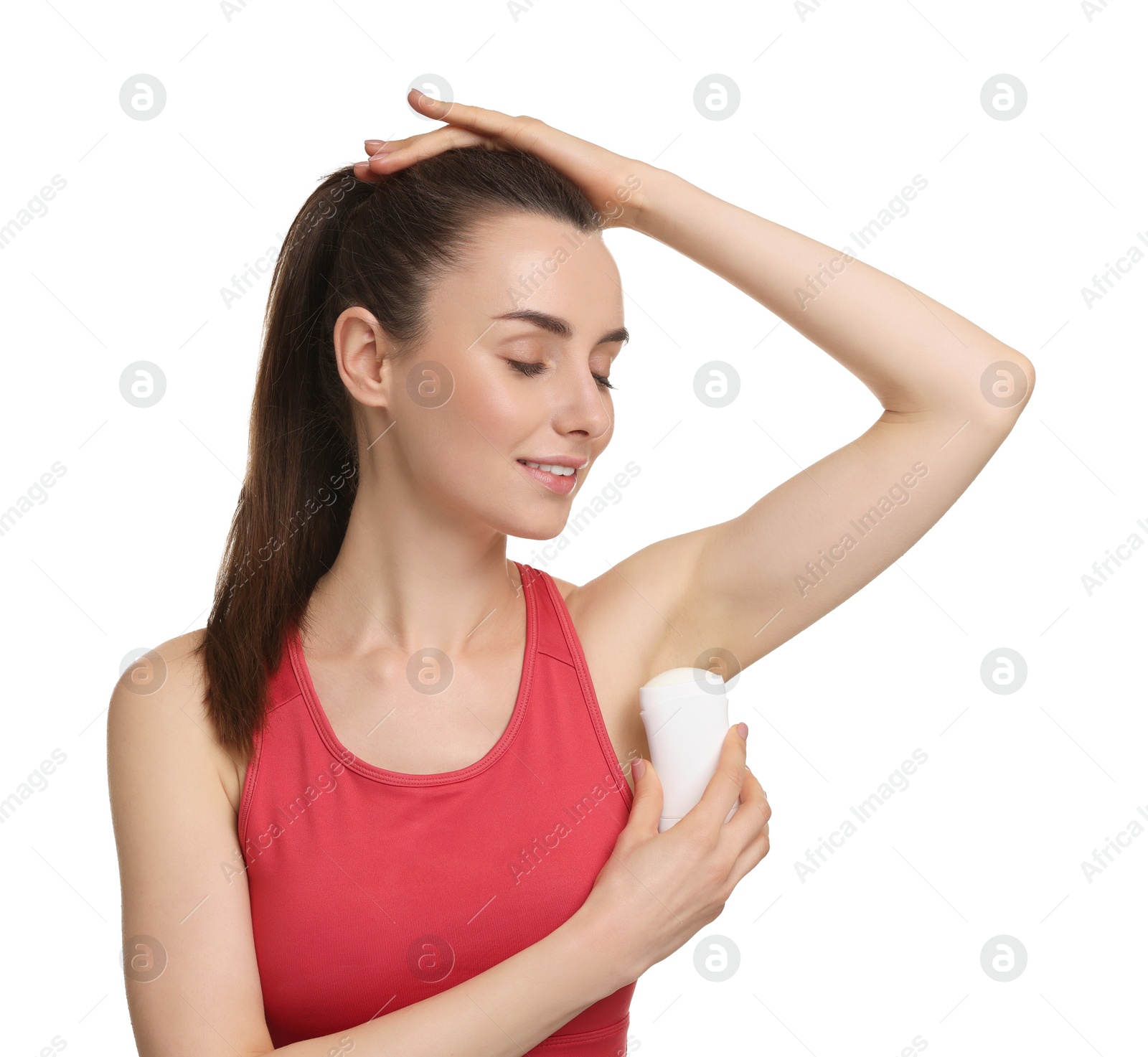 Photo of Beautiful woman applying deodorant on white background