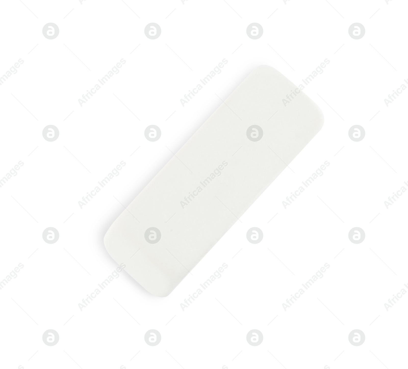 Photo of New eraser isolated on white, top view. School stationery