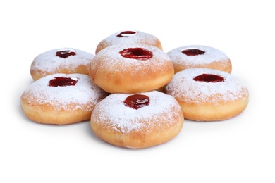 Photo of Hanukkah doughnuts with jelly and sugar powder on white background