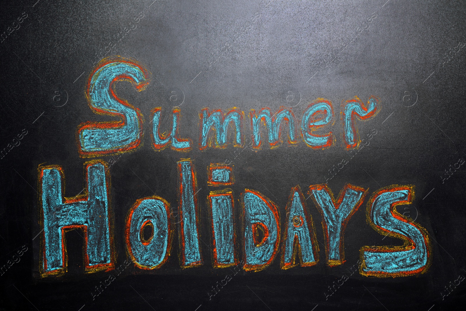 Photo of Inscription Summer Holidays written on blackboard. School break