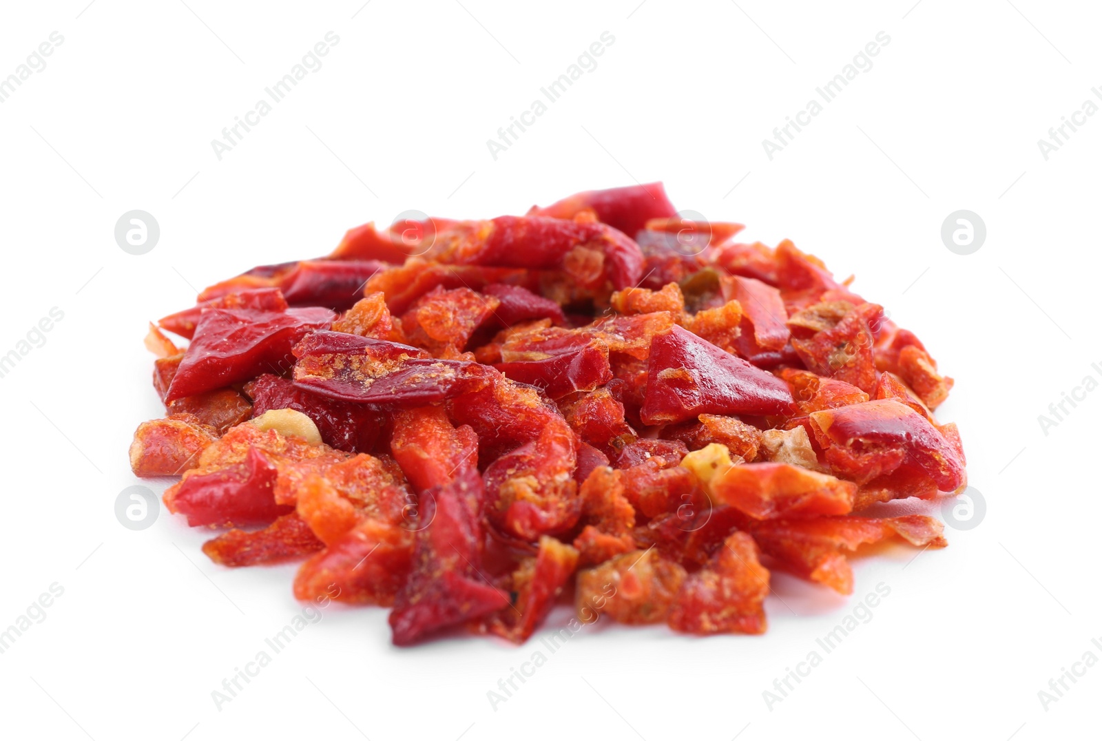 Photo of Aromatic spice. Red chili pepper flakes isolated on white