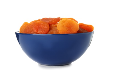 Bowl with apricots on white background. Dried fruit as healthy food